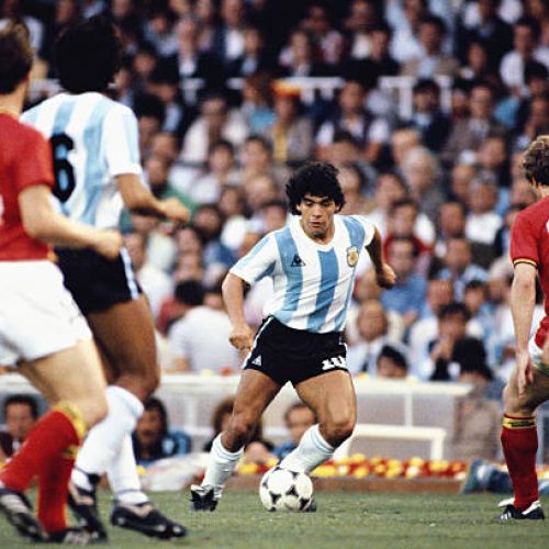 BARCELONA, SPAIN - JUNE 13: Argentina player Diego Maradona (c) takes on the Belguim defence during the 1982 FIFA World Cup match between Argentina and Belguim at the Nou Camp stadium on June 13, 1982 in Barcelona, Spain.  (Photo by Steve Powell/Allsport/Getty Images)